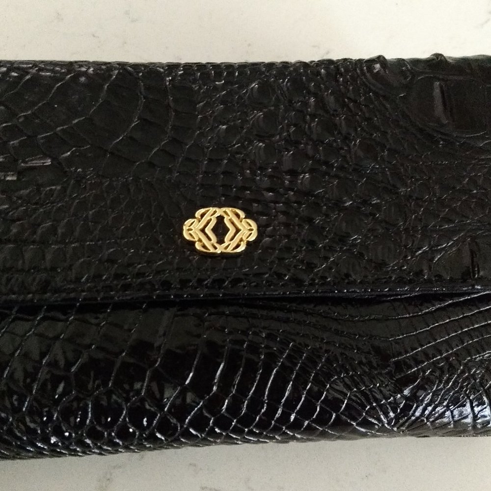 Multifunctional Clutch in black Embossed Alligator faux Patent Leather.